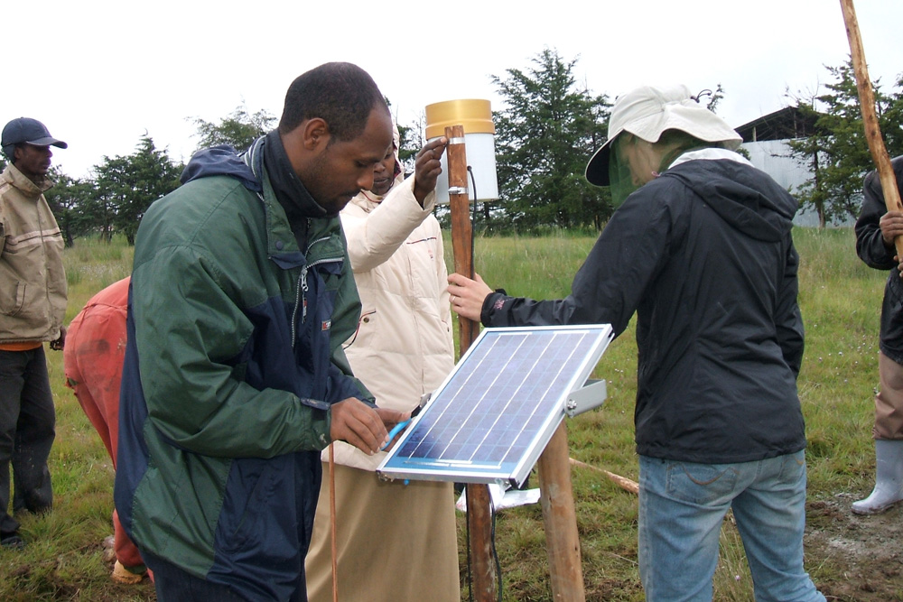 Engineers installing solar panel