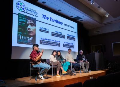 A panel is discussing "The Territory" in the Konover Auditorium at The Dodd Center for Human Rights as a part of the Northeast Human Rights Film Festival. 