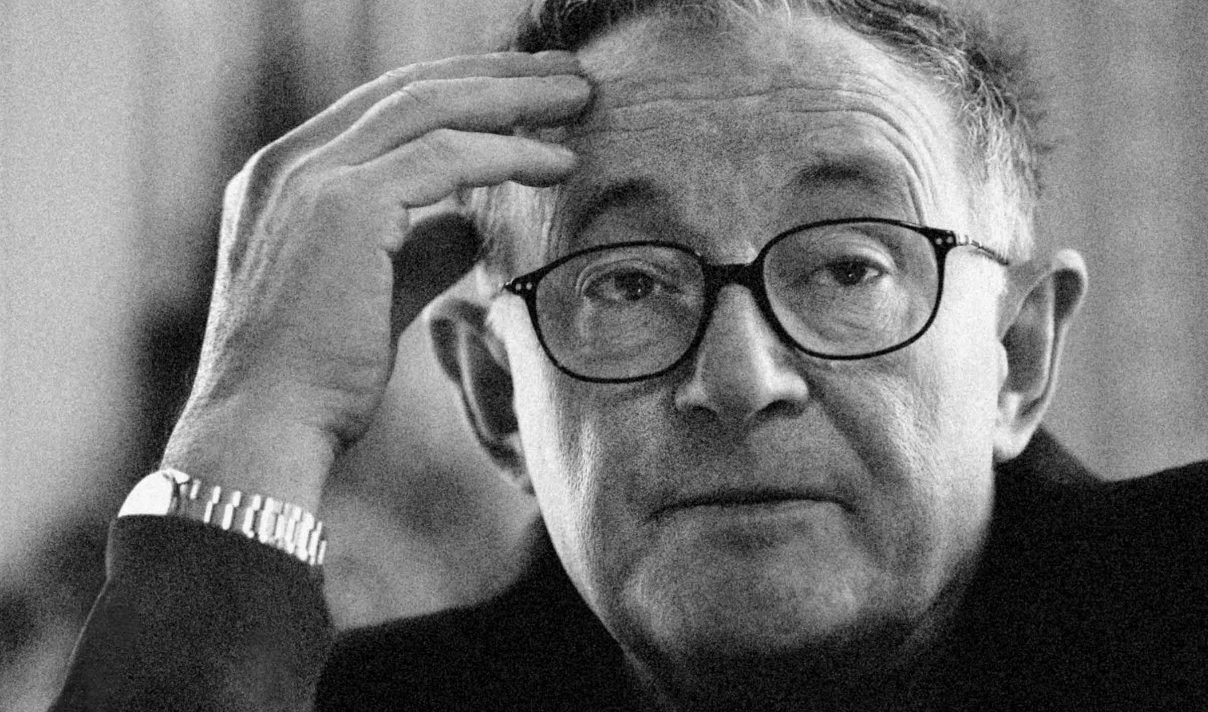 Wiktor Osiatynski, a prominent Polish activist and professor, lifts his hand to his forehead in contemplation.