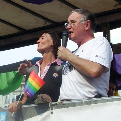 Wiktor speaking from a public event with wife Ewa Woydyłło-Osiatyńska by his side.