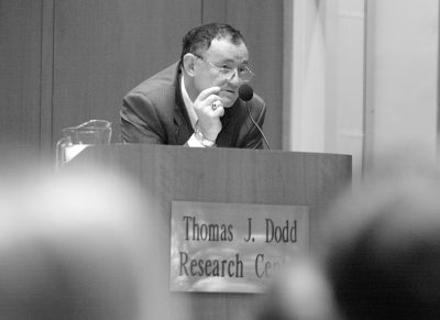 Wiktor Osiatyński speaks from the podium in the then-Thomas J Dodd. Research Center at UConn.